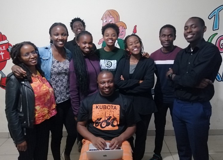 Talmon Mwakesi, who is the founder of Yada Innovations, poses for a photo alongside colleagues.